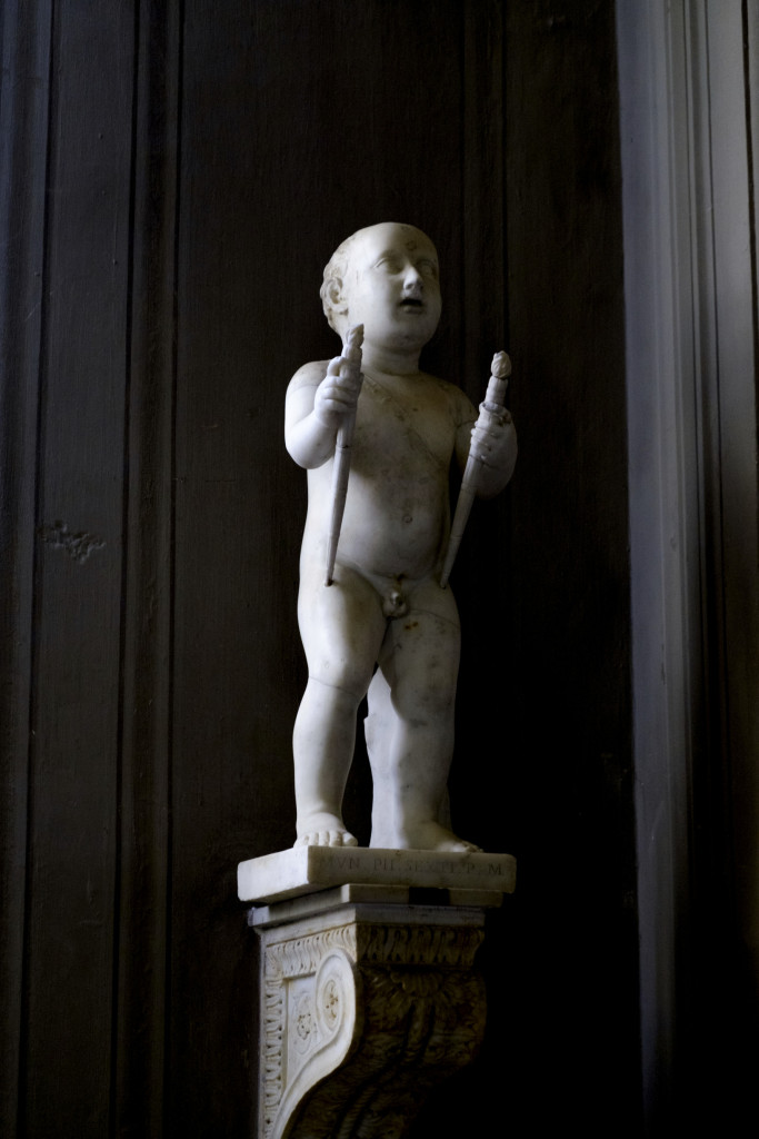 Baby statue in the Galleria dei Candelabri